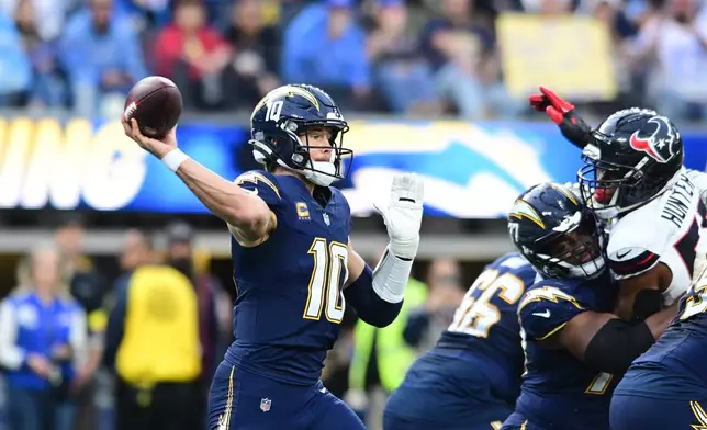 Los Angeles Chargers quarterback Justin Herbert (10) throws a pass during the first half of an NFL football game against the Houston Texans Saturday, Dec. 27, 2025, in Inglewood, Calif. (AP Photo/Wally Skalij)