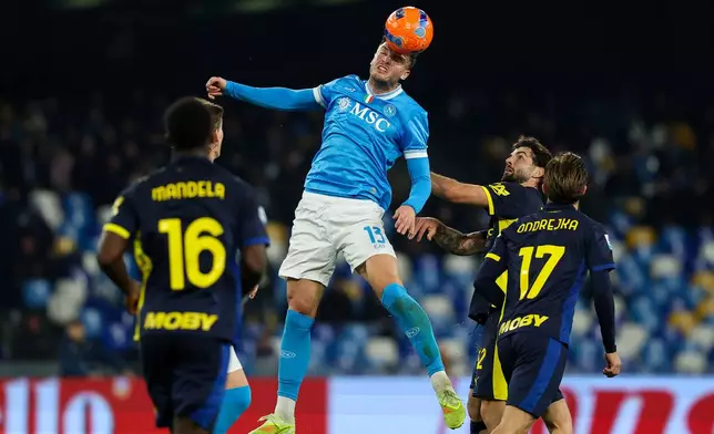 Napoli's Amir Rrahmani, center, in action during the Serie A soccer match between Napoli and Parma, in Naples, Italy, Wednesday, Jan. 14, 2026. (Alessandro Garofalo/LaPresse via AP)