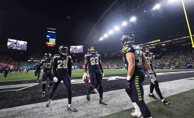 Seattle Seahawks' Dareke Young (83) celebrates after recovering a fumble by Los Angeles Rams wide receiver Xavier Smith during a punt return during the second half of the NFC Championship NFL football game Sunday, Jan. 25, 2026, in Seattle. (AP Photo/Lindsey Wasson)