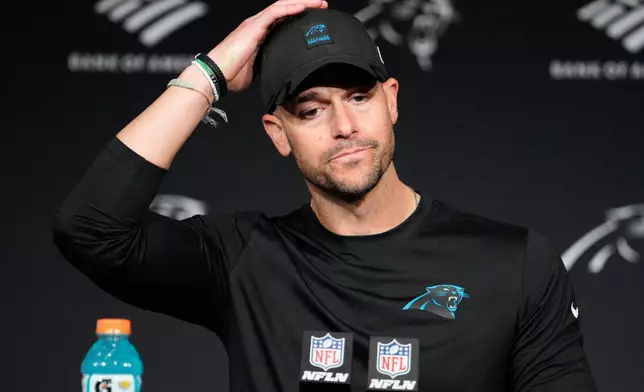 Carolina Panthers head coach Dave Canales answers questions after an NFL wild-card playoff football game against the Los Angeles Rams, Saturday, Jan. 10, 2026, in Charlotte, N.C. (AP Photo/Jacob Kupferman)