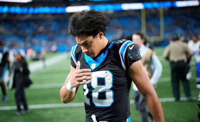 Carolina Panthers wide receiver Jalen Coker (18) walks off the field after a loss to the Los Angeles Rams during an NFL wild-card playoff football game, Saturday, Jan. 10, 2026, in Charlotte, N.C. (AP Photo/Jacob Kupferman)