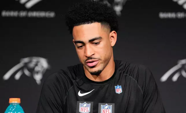 Carolina Panthers quarterback Bryce Young answers questions after an NFL wild-card playoff football game against the Los Angeles Rams, Saturday, Jan. 10, 2026, in Charlotte, N.C. (AP Photo/Jacob Kupferman)