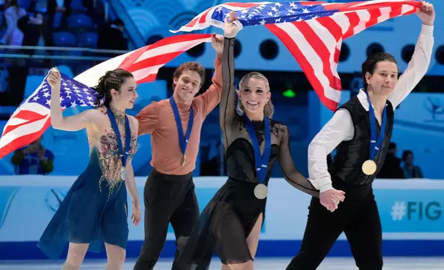 From left silver medalists Caroline Green and Michael Parsons of the United States and gold medalists Emilea Zingas and Vadym Kolesnik of the United States celebrate after the Ice Dance Free Dance of the ISU Four Continents Figure Skating Championships in Beijing, China, Friday, Jan. 23, 2026. (AP Photo/Vincent Thian)