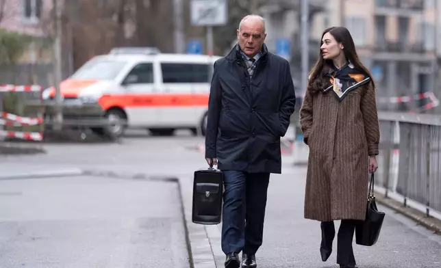 Sanija Ameti, right, a Swiss politician, arrives with her lawyer for her trial at the Zurich District Court, Wednesday, January 28, 2026, in Zurich, Switzerland. (Claudio Thoma/Keystone via AP)