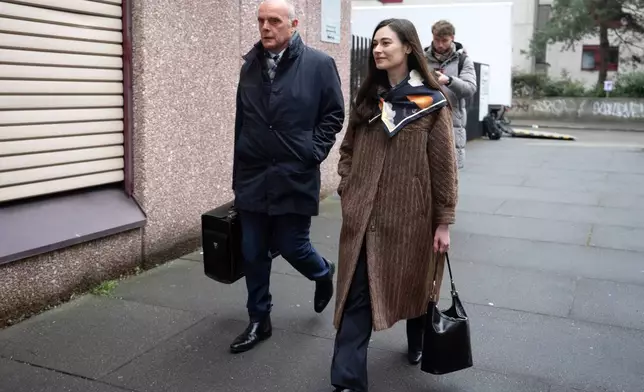 Sanija Ameti, right, a Swiss politician, arrives with her lawyer for her trial at the Zurich District Court, Wednesday, January 28, 2026, in Zurich, Switzerland. (Claudio Thoma/Keystone via AP)