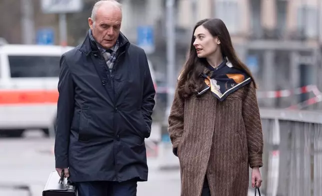 Sanija Ameti, right, a Swiss politician, arrives with her lawyer for her trial at the Zurich District Court, Wednesday, January 28, 2026, in Zurich, Switzerland. (Claudio Thoma/Keystone via AP)