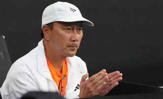 Michael Chang, coach of Learner Tien of the U.S. reacts during his fourth round match against Daniil Medvedev of Russia at the Australian Open tennis championship in Melbourne, Australia, Sunday, Jan. 25, 2026. (AP Photo/Asanka Brendon Ratnayake)