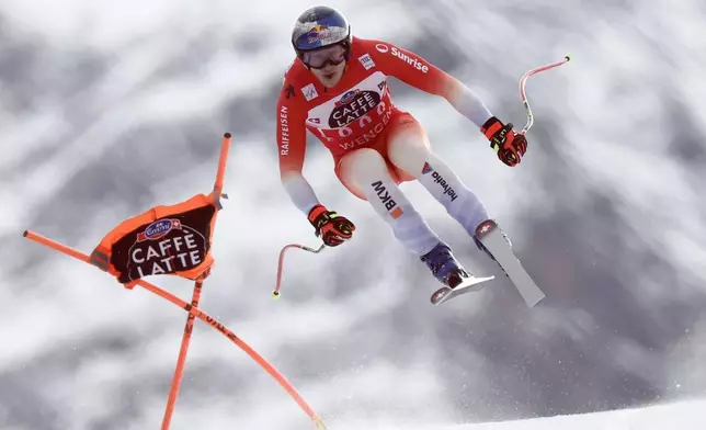 Switzerland's Marco Odermatt speeds down the course during an alpine ski, men's World Cup downhill, in Wengen, Switzerland, Saturday, Jan. 17, 2026. (AP Photo/Gabriele Facciotti)