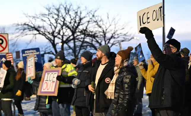 Protesters gather outside the Bishop Henry Whipple Federal Building, Thursday, Jan. 8, 2026, in Minneapolis, Minn. (AP Photo/Tom Baker)
