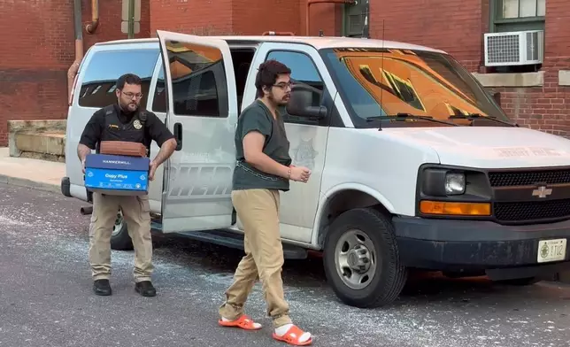 In this image from video, Daniel Blank, who is associated with a cultlike group known as Zizians that is linked to several deaths across the U.S., is escorted into court for a pretrial hearing on trespassing, gun and drug charges in Cumberland, Md., Friday, Jan. 16, 2026. (AP Photo/Mark Scolforo)