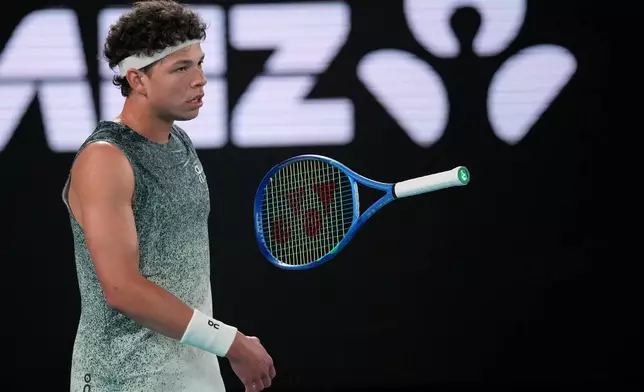 Ben Shelton of the U.S. reacts during his quarterfinal match against Jannik Sinner of Italy at the Australian Open tennis championship in Melbourne, Australia, Wednesday, Jan. 28, 2026. (AP Photo/Dita Alangkara)