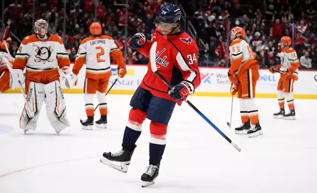 Washington Capitals right wing Justin Sourdif (34) celebrates after his goal against the Anaheim Ducks during the first period of an NHL hockey game, Monday, Jan. 5, 2026, in Washington. (AP Photo/Nick Wass)