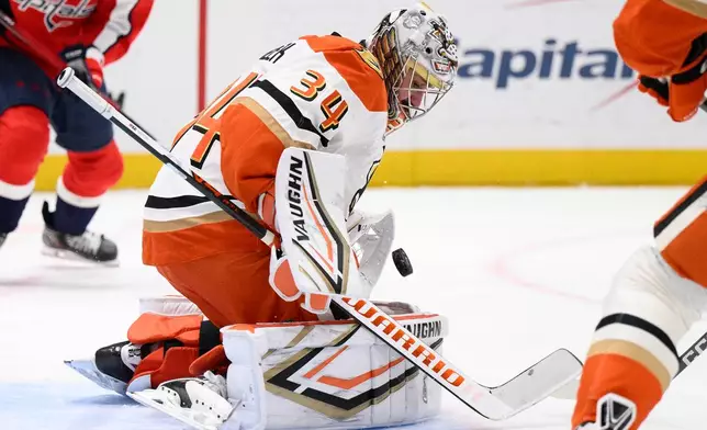 Anaheim Ducks goaltender Petr Mrazek (34) stops the puck during the first period of an NHL hockey game against the Washington Capitals, Monday, Jan. 5, 2026, in Washington. (AP Photo/Nick Wass)