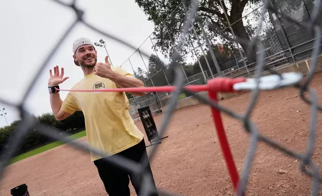 Daulton Jefferies stretches before working out at Heather Farms Park in Walnut Creek, Calif., Saturday, Dec. 13, 2025. (AP Photo/Godofredo A. Vásquez)