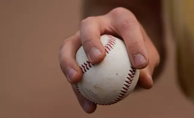 Daulton Jefferies grips a baseball while working out at Heather Farms Park in Walnut Creek, Calif., Saturday, Dec. 13, 2025. (AP Photo/Godofredo A. Vásquez)