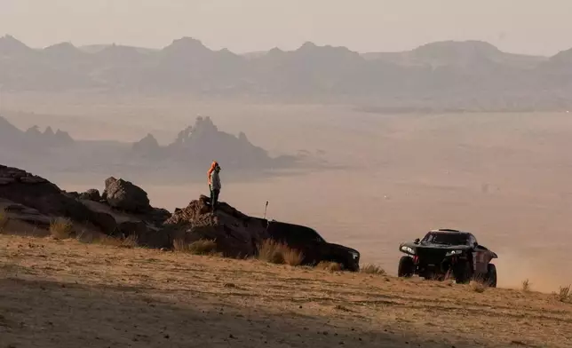 Driver Mathieu Serradori and co-driver Loic Minaudier compete during the fifth stage of the Dakar Rally between Alula and Hail, Saudi Arabia, Thursday, Jan. 8, 2026. (AP Photo/Thibault Camus)