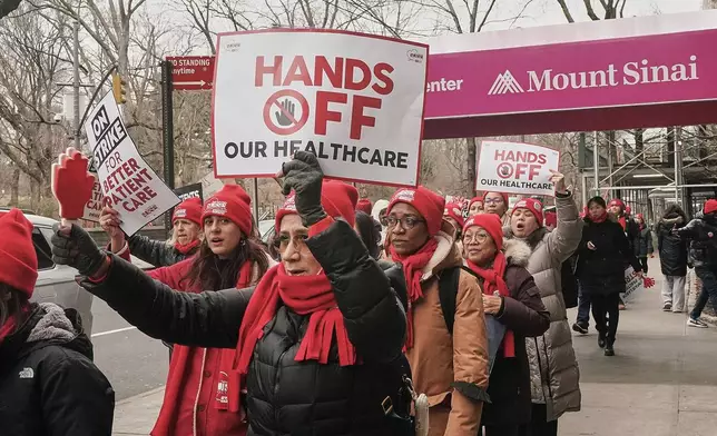 Striking nurses demonstrate outside Mt. Sinai Hospital, in New York, Wednesday, Jan. 14, 2026. (AP Photo/Richard Drew)