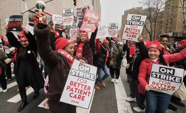 Striking nurses demonstrate outside Mt. Sinai Hospital, in New York, Wednesday, Jan. 14, 2026. (AP Photo/Richard Drew)