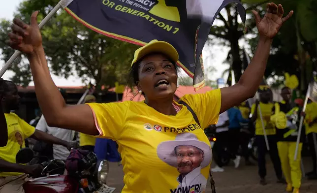 A woman celebrates Ugandan President Yoweri Museveni's victory in the presidential election in Kampala, Uganda, Saturday, Jan. 17, 2026. (AP Photo/Brian Inganga)