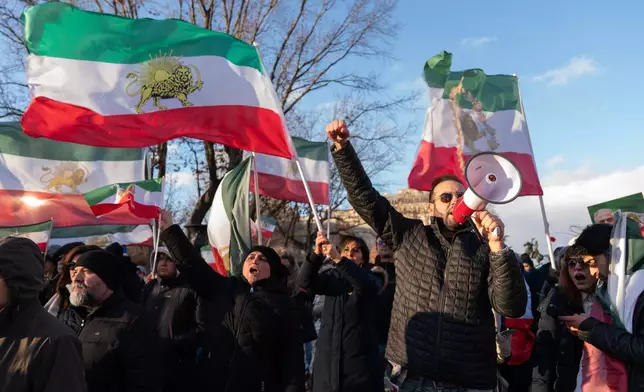 Activists take part in a rally supporting protesters in Iran at Lafayette Park, across from the White House, in Washington, Sunday, Jan. 11, 2026. (AP Photo/Jose Luis Magana)