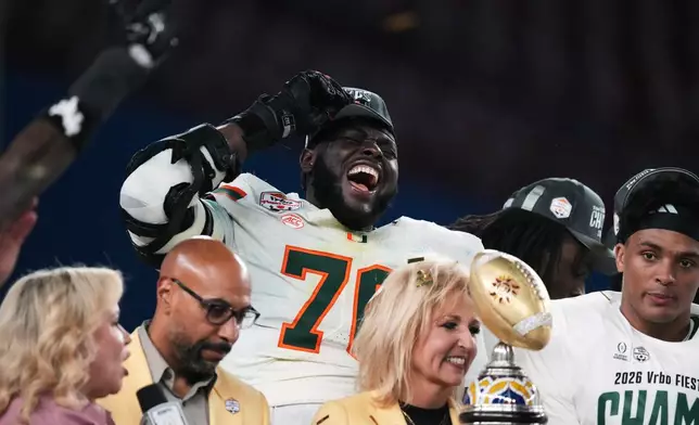 Miami offensive lineman Markel Bell celebrates after winning the Fiesta Bowl NCAA college football playoff semifinal game against Mississippi, Thursday, Jan. 8, 2026, in Glendale, Ariz. (AP Photo/Ross D. Franklin)