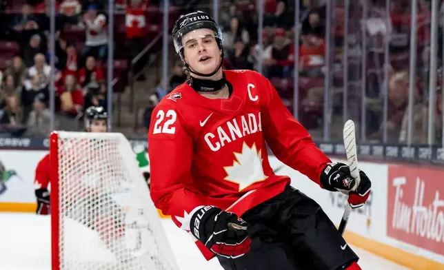 Canada's Porter Martone (22) celebrates after scoring during second-period IIHF World Junior Hockey Championship quarterfinals game action against Slovakia in Minneapolis, Friday, Jan. 2, 2026. (Christopher Katsarov/The Canadian Press via AP)