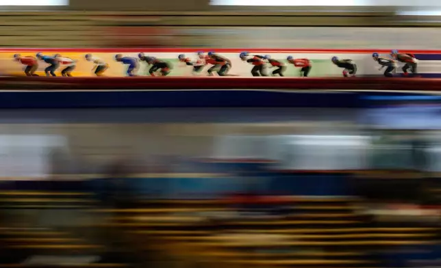 Athletes compete during the men's mass start race at the World Cup speed skating event in Inzell Germany, Sunday, Jan. 25, 2026. (AP Photo/Matthias Schrader)