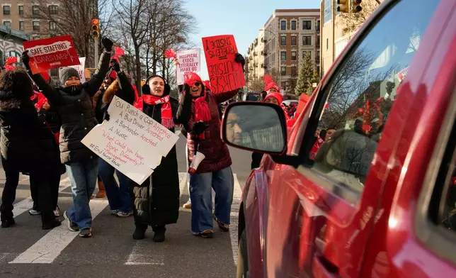 Nurses strike outside New York-Presbyterian Hospital, Monday, Jan. 12, 2026, in New York. (AP Photo/Yuki Iwamura)