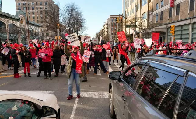 Nurses strike outside New York-Presbyterian Hospital, Monday, Jan. 12, 2026, in New York. (AP Photo/Yuki Iwamura)