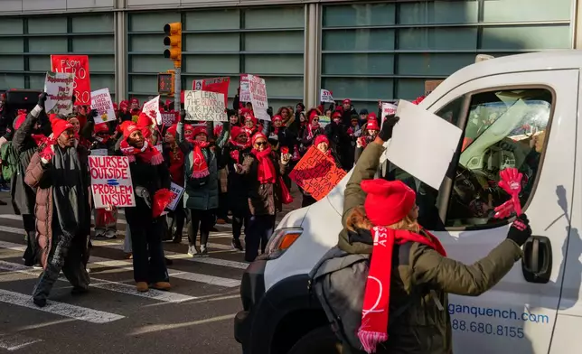 Nurses strike outside New York-Presbyterian Hospital, Monday, Jan. 12, 2026, in New York. (AP Photo/Yuki Iwamura)