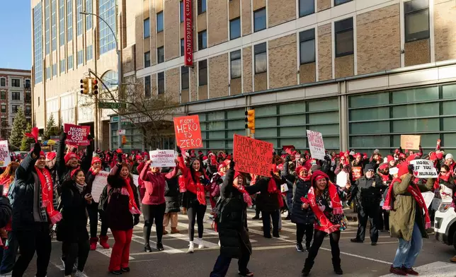 Nurses strike outside New York-Presbyterian Hospital, Monday, Jan. 12, 2026, in New York. (AP Photo/Yuki Iwamura)