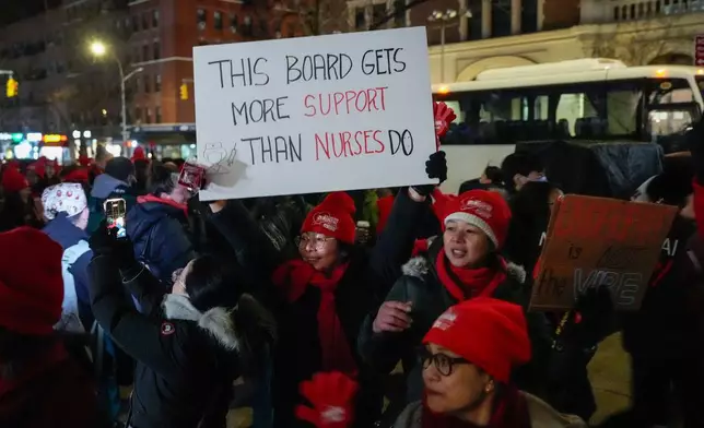 Nurses strike outside Mount Sinai West Hospital, Monday, Jan. 12, 2026, in New York. (AP Photo/Yuki Iwamura)