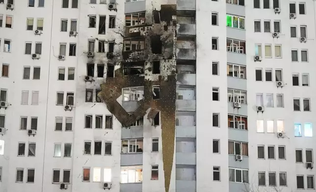 A residential building is seen damaged after a Russian strike in Kyiv, Ukraine, Friday, Jan. 9, 2026. (AP Photo/Efrem Lukatsky)