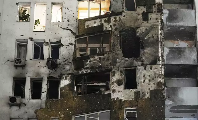 A residential building is seen damaged after a Russian strike in Kyiv, Ukraine, Friday, Jan. 9, 2026. (AP Photo/Efrem Lukatsky)