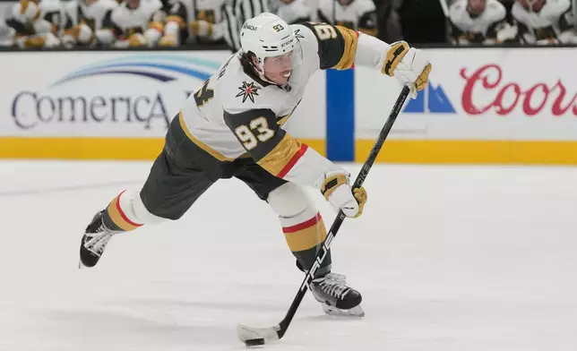Vegas Golden Knights right wing Mitch Marner (93) passes the puck against the San Jose Sharks during the second period of an NHL hockey game in San Jose, Calif., Sunday, Jan. 11, 2026. (AP Photo/Jeff Chiu)
