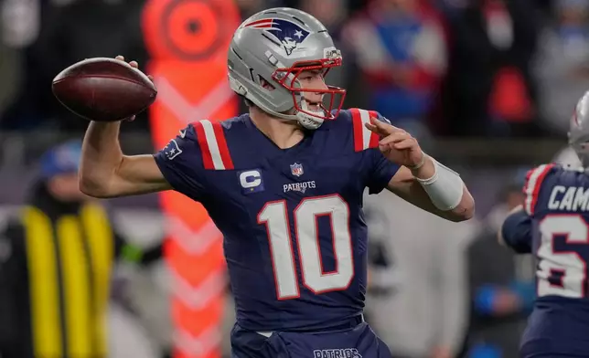 New England Patriots quarterback Drake Maye (10) passes in the first half of an NFL wild-card playoff football game against the Los Angeles Chargers, in Foxborough, Mass., Sunday, Jan. 11, 2026. (AP Photo/Charles Krupa)
