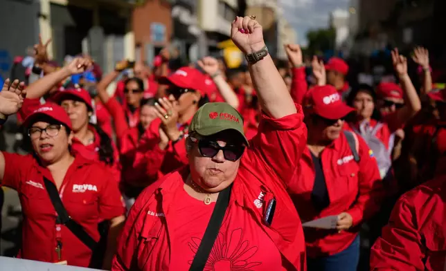 Workers of Venezuela's state-owned PDVSA oil company rally to back an oil reform bill proposed by acting President Delcy Rodriguez to loosen state control and open the industry to private and foreign investment in Caracas, Venezuela, Thursday, Jan. 29, 2026. (AP Photo/Ariana Cubillos)