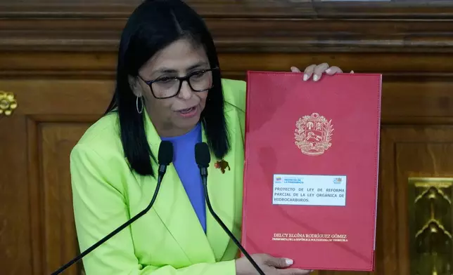 Venezuela's acting President Delcy Rodriguez delivers her first state of the union address at the National Assembly in Caracas, Venezuela, Thursday, Jan. 15, 2026. (AP Photo/Ariana Cubillos)