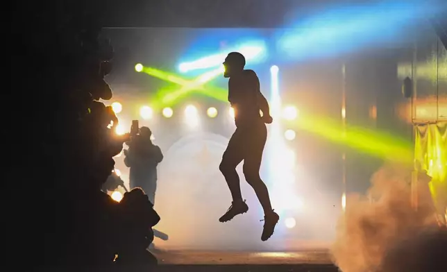 Pittsburgh Steelers outside linebacker T.J. Watt jumps in the air during player introductions before an NFL football game against the Baltimore Ravens, Sunday, Jan. 4, 2026, in Pittsburgh. (AP Photo/Justin Berl)