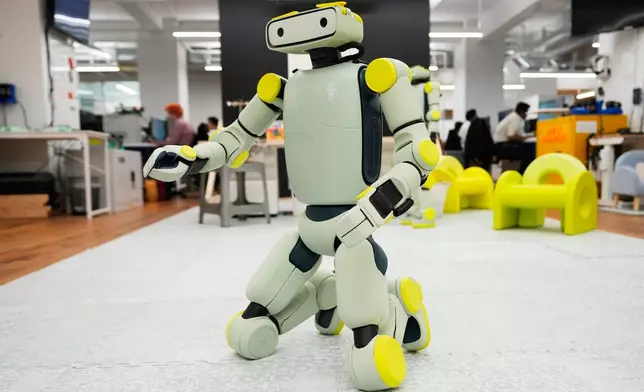 Fauna Robotics' new robot, called Spout, gets up from the prone position to demonstrate its maneuverability in New York, Wednesday, Jan. 14, 2026. (AP Photo/Seth Wenig)