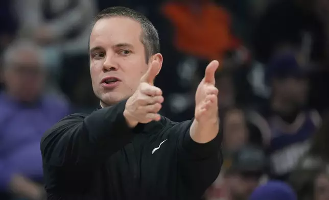 Phoenix Suns head coach Jordan Ott shouts instructions to his players during the first half of an NBA basketball game against the Washington Wizards, Sunday, Jan. 11, 2026, in Phoenix. (AP Photo/Ross D. Franklin)
