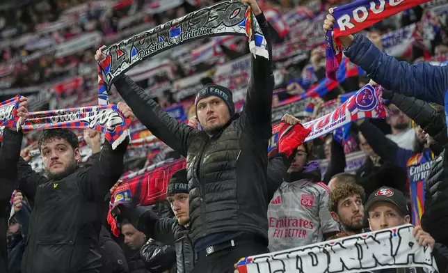 Lyon fans cheer their team ahead of the Europa League soccer match between Lyon and PAOK in Lyon, France, Thursday, Jan. 29, 2026. (AP Photo/Laurent Cipriani)