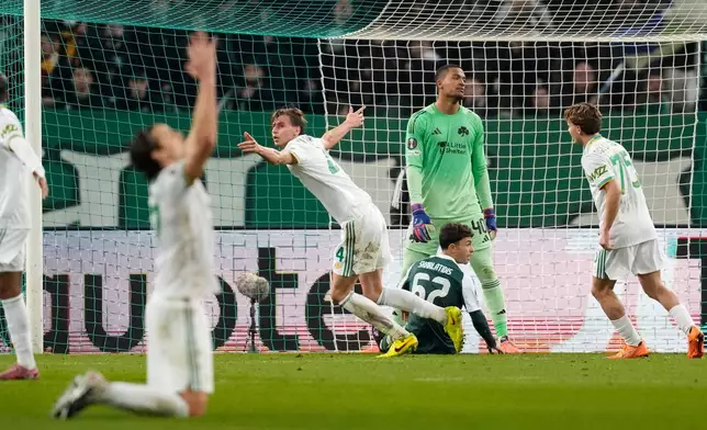 Roma's Jan Ziolkowski, center, celebrates after he scored his side's first goal during an Europa League soccer match between Panathinaikos and Roma, in Athens, Greece, Thursday, Jan. 29, 2026. (AP Photo/Petros Giannakouris)