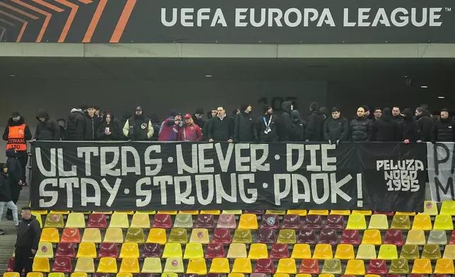 FCSB fans display a banner in memory of the seven Greek PAOK fans killed in a car crash in Romania ahead of the Europa League soccer match between FCSB and Fenerbahce in Bucharest, Thursday, Jan. 29, 2026. (AP Photo/Andreea Alexandru)