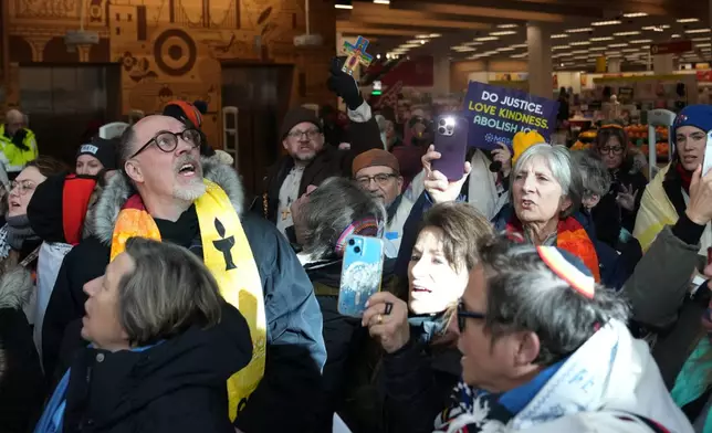 Protesters gather at Target, Friday, Jan. 23, 2026, in Minneapolis. (AP Photo/Abbie Parr)
