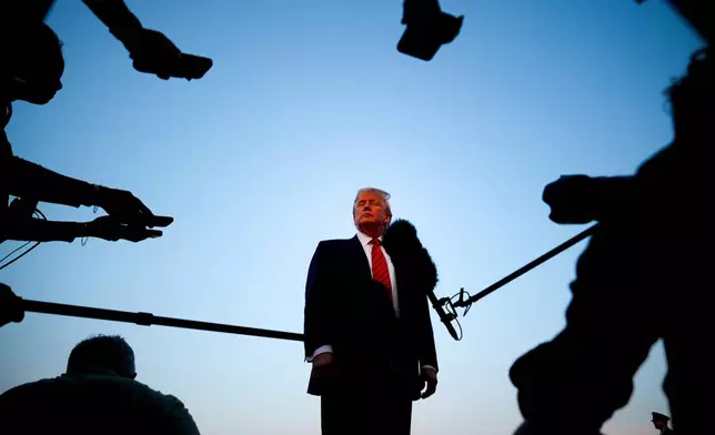 FILE - President Donald Trump speaks with reporters before boarding Air Force One at Lehigh Valley International Airport in Allentown, Pa., Aug. 3, 2025. (AP Photo/Julia Demaree Nikhinson, File)