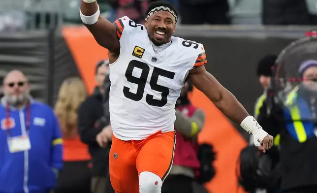 Cleveland Browns defensive end Myles Garrett (95) celebrates after kicker Andre Szmyt kicked the game winning field goal during the second half of an NFL football game against the Cincinnati Bengals, Sunday, Jan. 4, 2026, in Cincinnati. (AP Photo/Joshua A. Bickel)