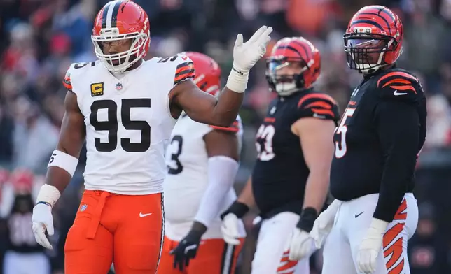 Cleveland Browns defensive end Myles Garrett (95) gestures during the first half of an NFL football game against the Cincinnati Bengals, Sunday, Jan. 4, 2026, in Cincinnati. (AP Photo/Jeff Dean)