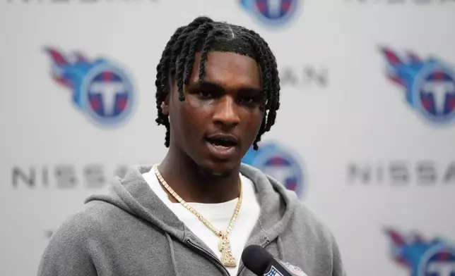 Tennessee Titans quarterback Cam Ward talks to reporters after an NFL football game against the New Orleans Saints, Sunday, Dec. 28, 2025, in Nashville, Tenn. (AP Photo/George Walker IV)