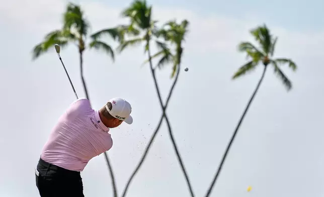 Brice Garnett hits on the 16th hole during the first round of the Sony Open golf event at the Waialae Country Club in Honolulu, Thursday, Jan. 15, 2026. (AP Photo/Matt York)